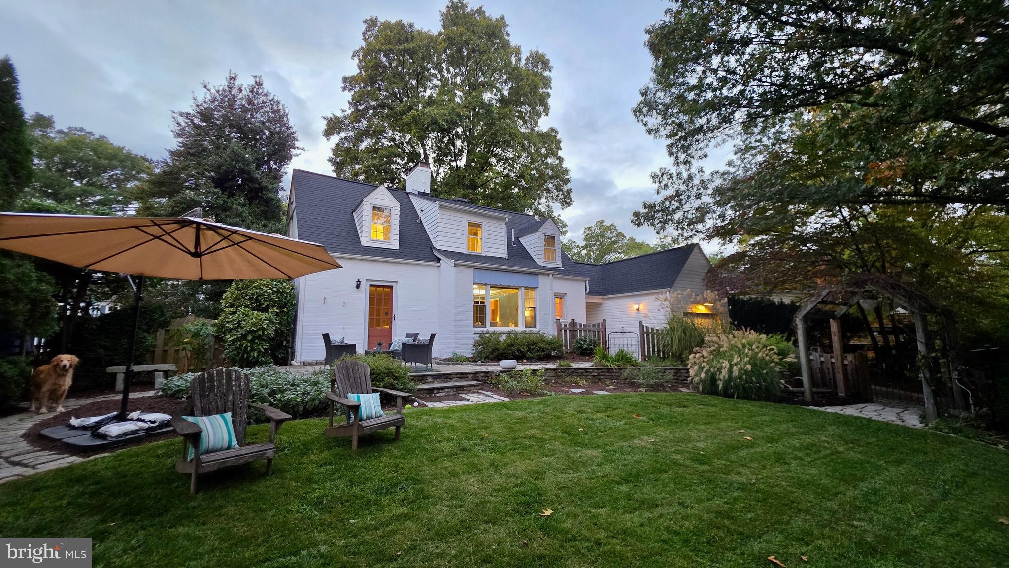 a view of a house with a yard porch and sitting area