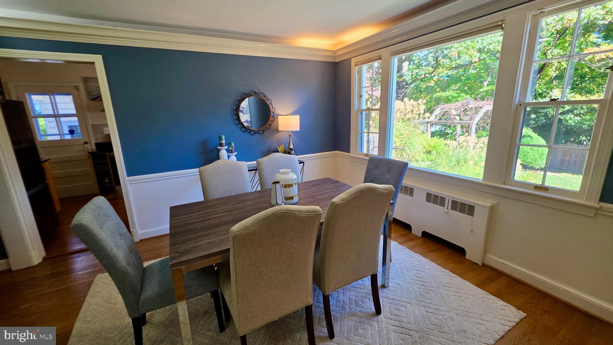 10309 Ridgemoor Drive Silver Spring, MD 20901 - Photo 19 of 139 a dining room with furniture a rug and wooden floor