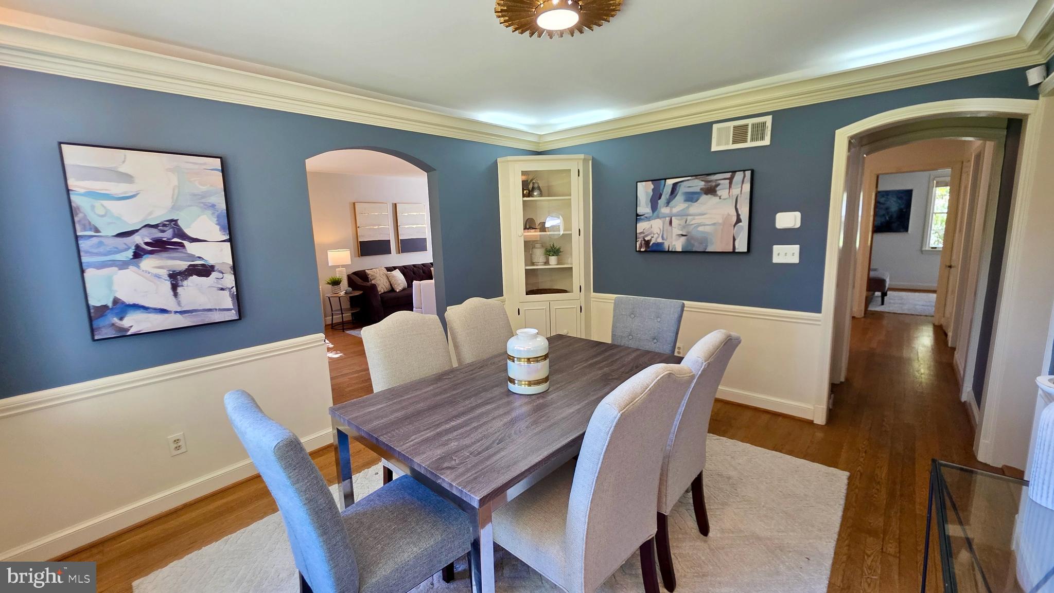 10309 Ridgemoor Drive Silver Spring, MD 20901 - Photo 22 of 139 a view of a dining room with furniture wooden floor and a rug