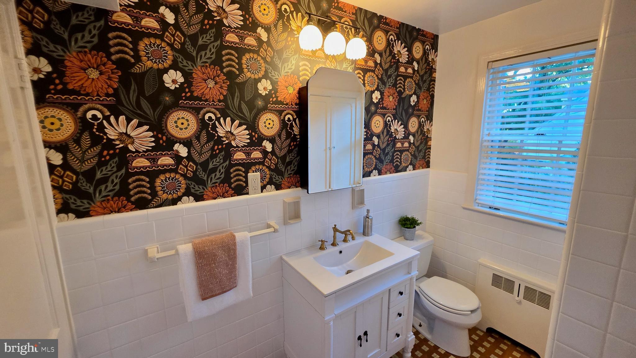 10309 Ridgemoor Drive Silver Spring, MD 20901 - Photo 39 of 139 a bathroom with a sink toilet and mirror
