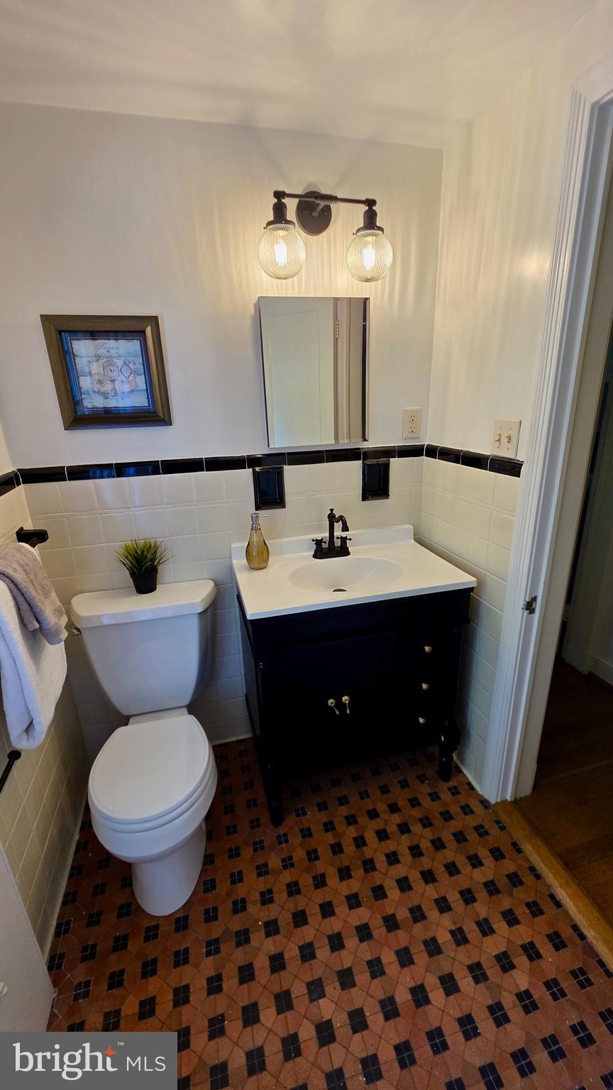 10309 Ridgemoor Drive Silver Spring, MD 20901 - Photo 57 of 139 a bathroom with a sink toilet and mirror
