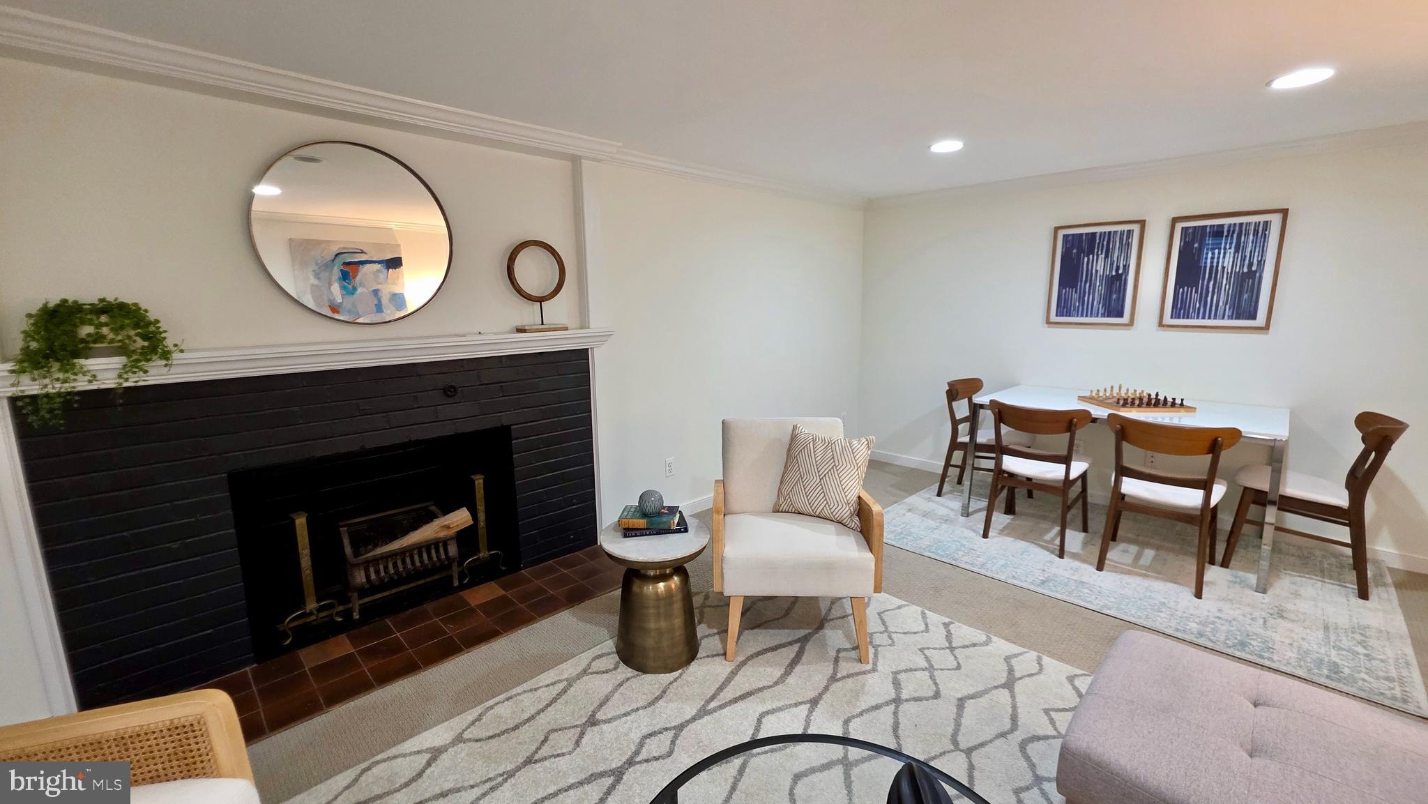 10309 Ridgemoor Drive Silver Spring, MD 20901 - Photo 77 of 139 a living room with furniture a mirror and a fireplace