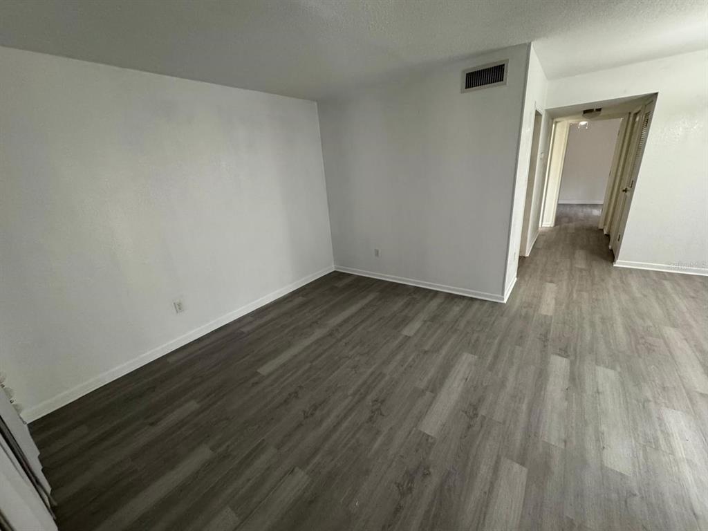 507 Northwest 39th Road, Unit 220 Gainesville, FL 32607 - Photo 21 of 21 a view of a room with wooden floor and staircase