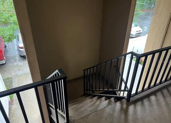 a view of a balcony with wooden floor