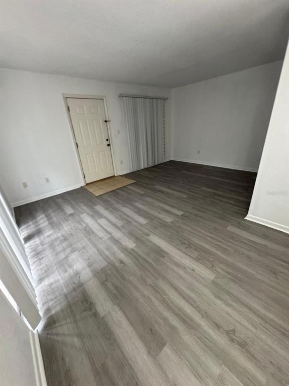 507 Northwest 39th Road, Unit 220 Gainesville, FL 32607 - Photo 6 of 21 a view of a room with wooden floor