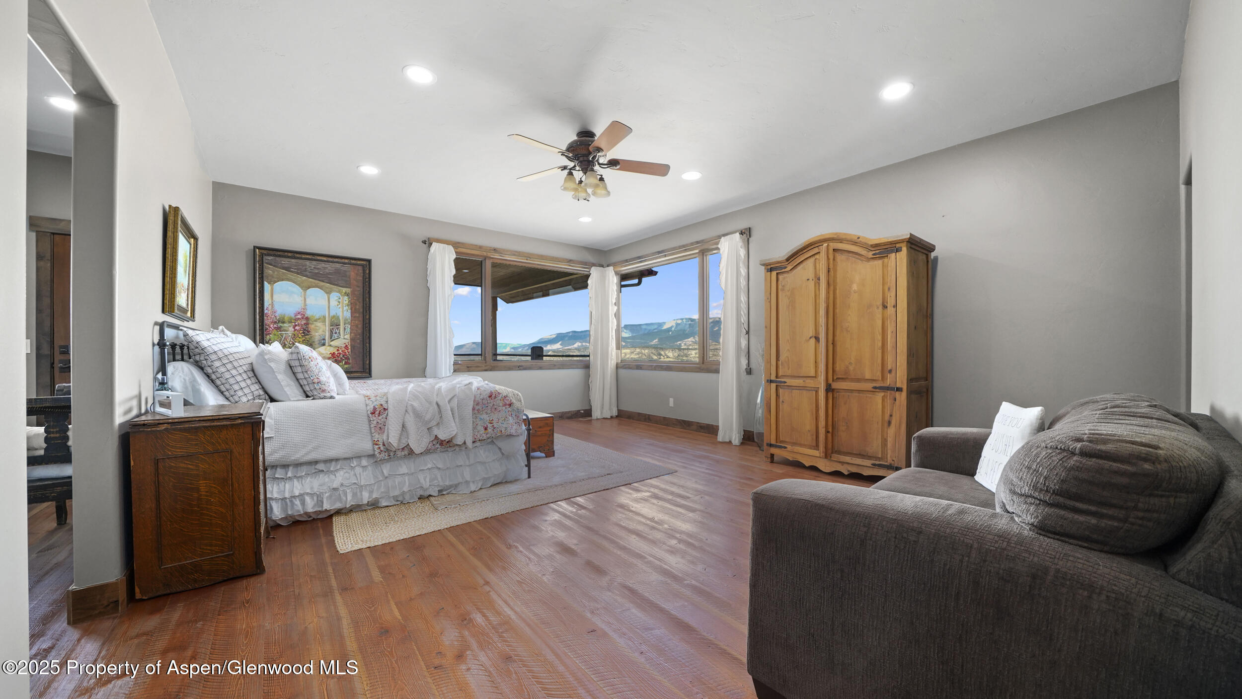 164 Booms Place Rifle, CO 81650 - Photo 11 of 33 a living room with furniture and a chandelier