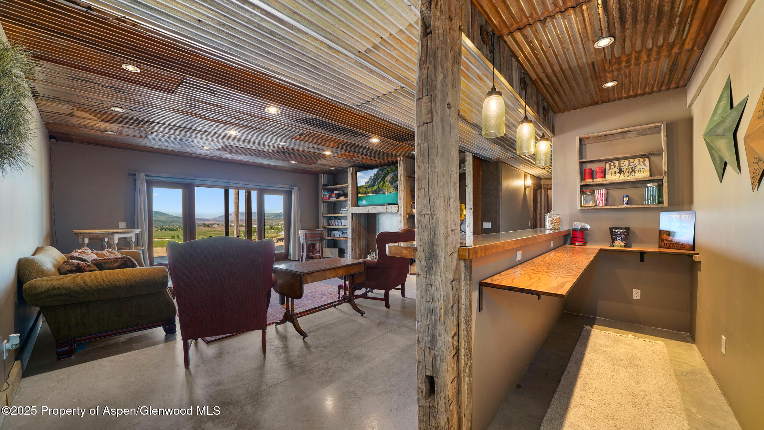 164 Booms Place Rifle, CO 81650 - Photo 15 of 33 a dining room with furniture and a floor to ceiling window