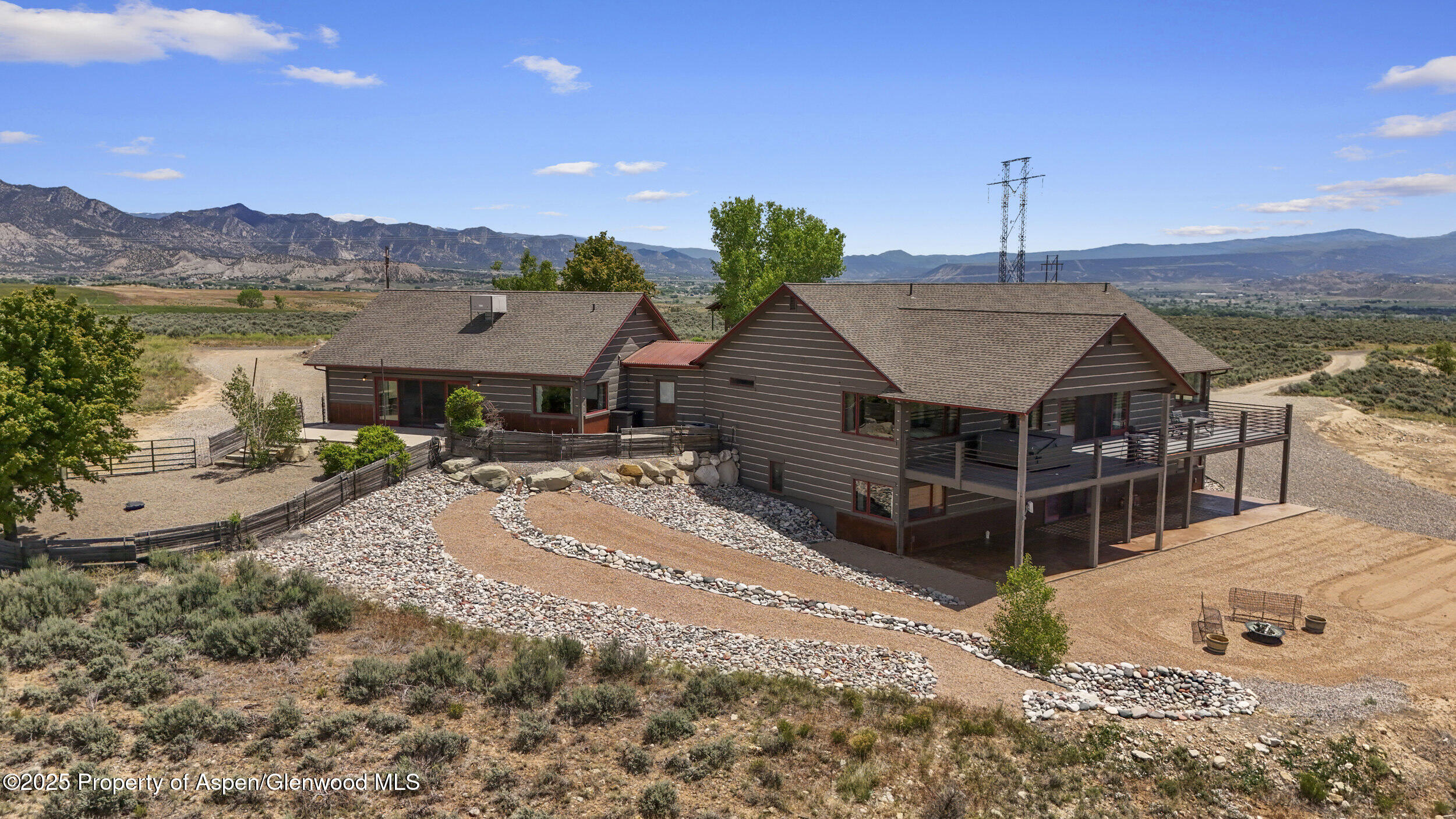 164 Booms Place Rifle, CO 81650 - Photo 2 of 33 a view of a house with a mountain in the background