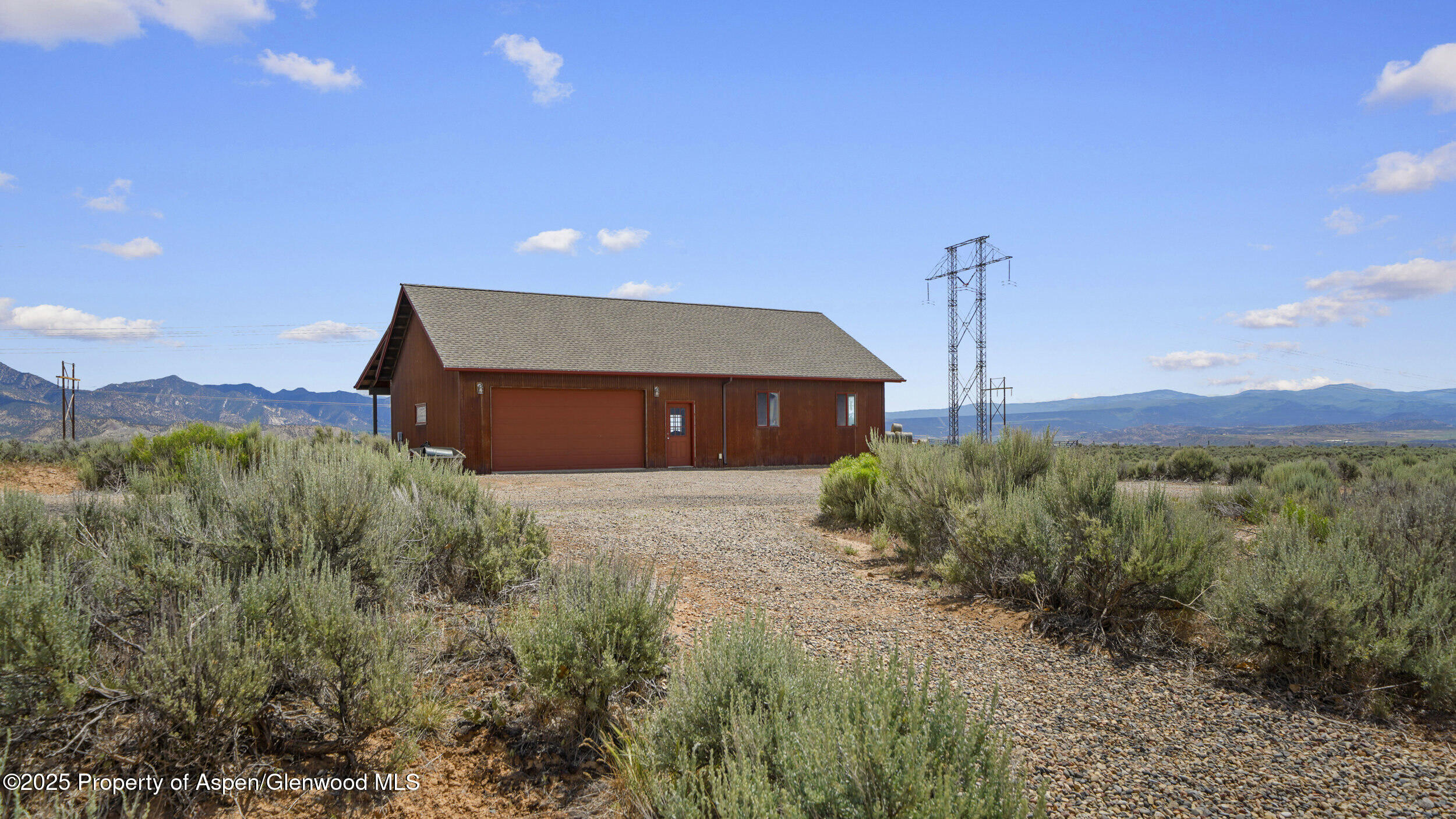 164 Booms Place Rifle, CO 81650 - Photo 21 of 33 a front view of a house with a yard and mountain view
