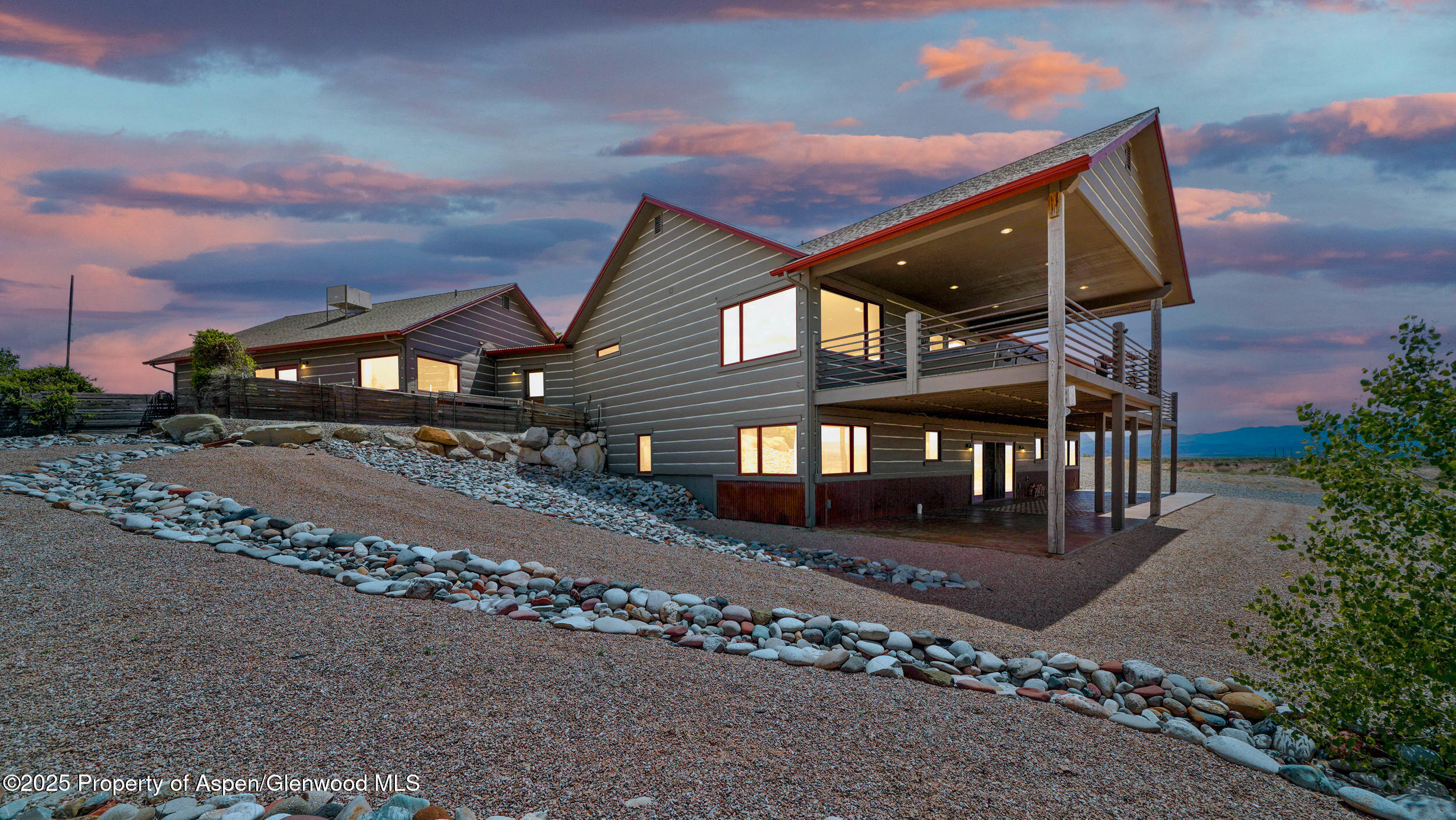 164 Booms Place Rifle, CO 81650 - Photo 24 of 33 a front view of a house with a yard