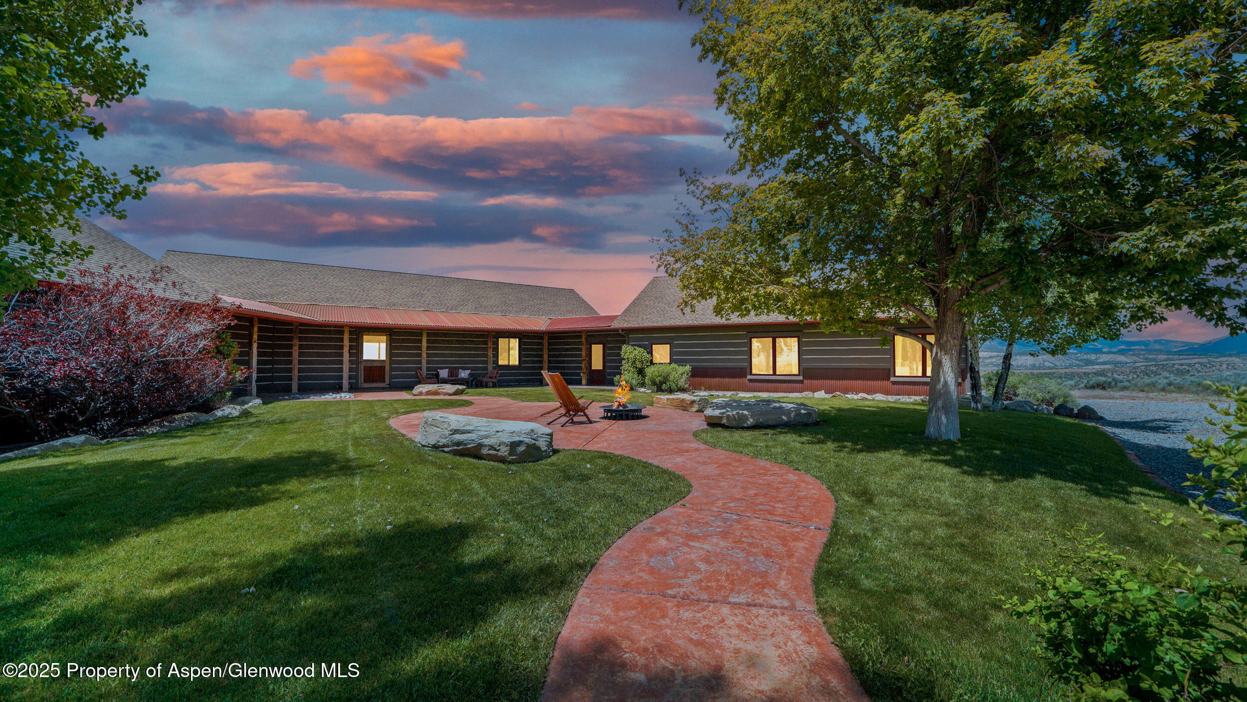 164 Booms Place Rifle, CO 81650 - Photo 25 of 33 a view of a house with backyard sitting area and garden