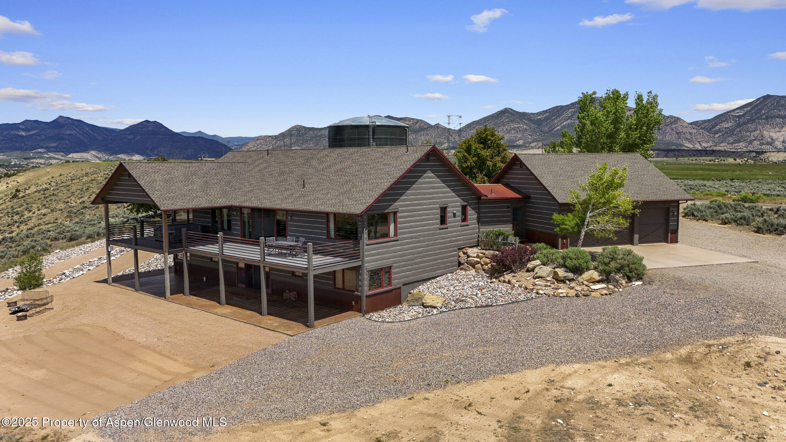 164 Booms Place Rifle, CO 81650 - Photo 3 of 33 a view of a house with a yard and sitting area
