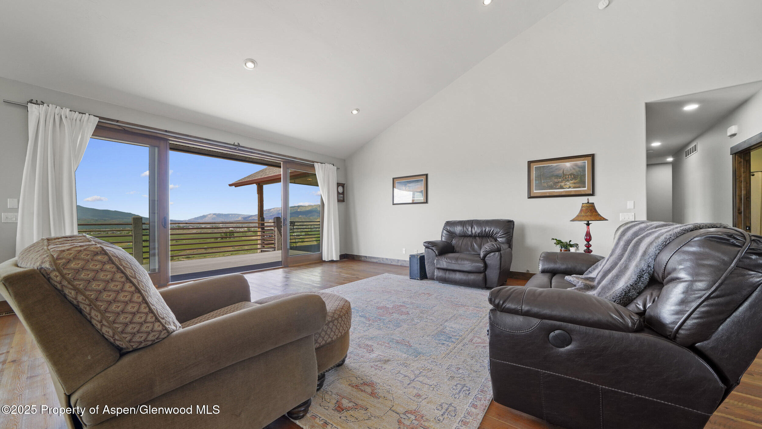 164 Booms Place Rifle, CO 81650 - Photo 10 of 33 a living room with furniture and a large window
