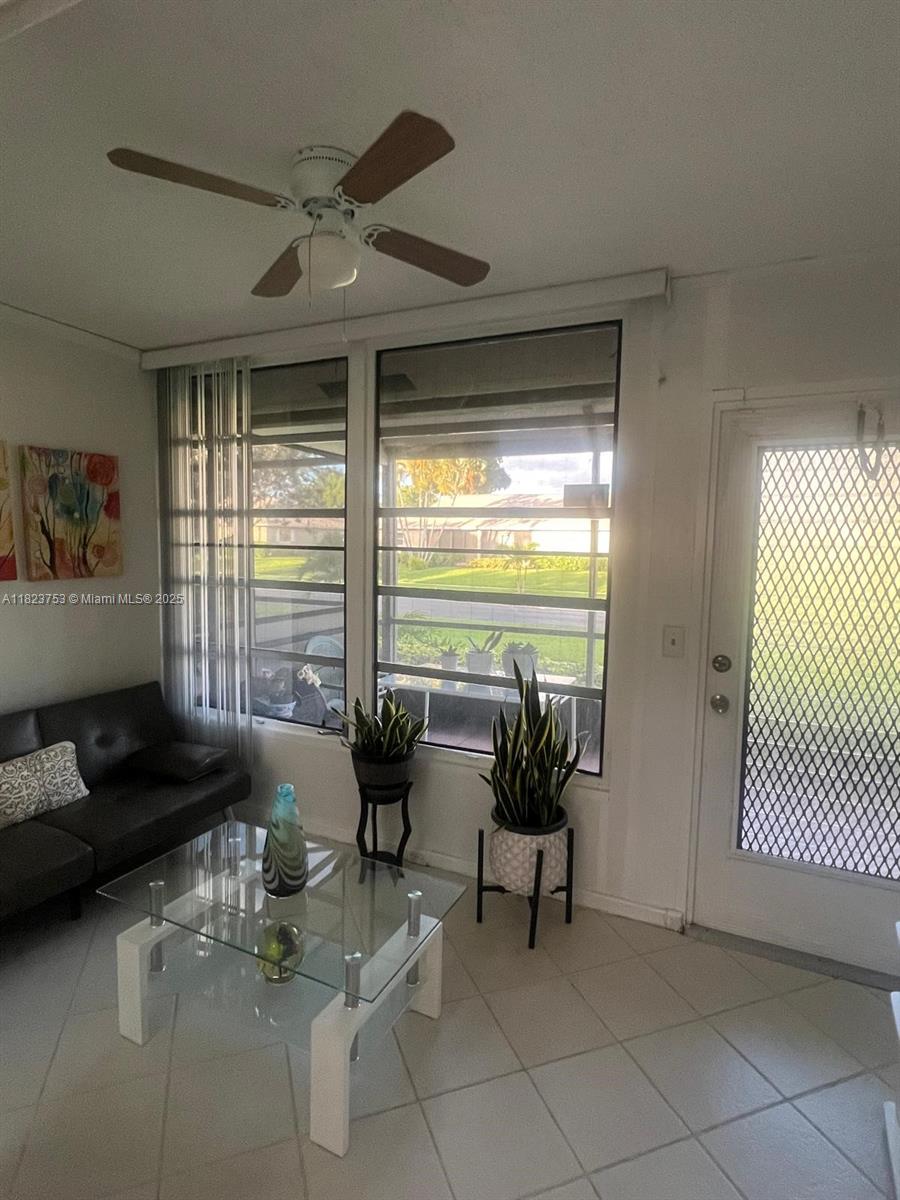 18906 Schooner Drive Boca Raton, FL 33496 - Photo 13 of 15 a living room with furniture and floor to ceiling window