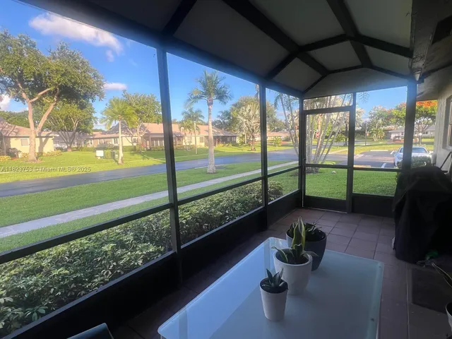 a view of a porch and garden
