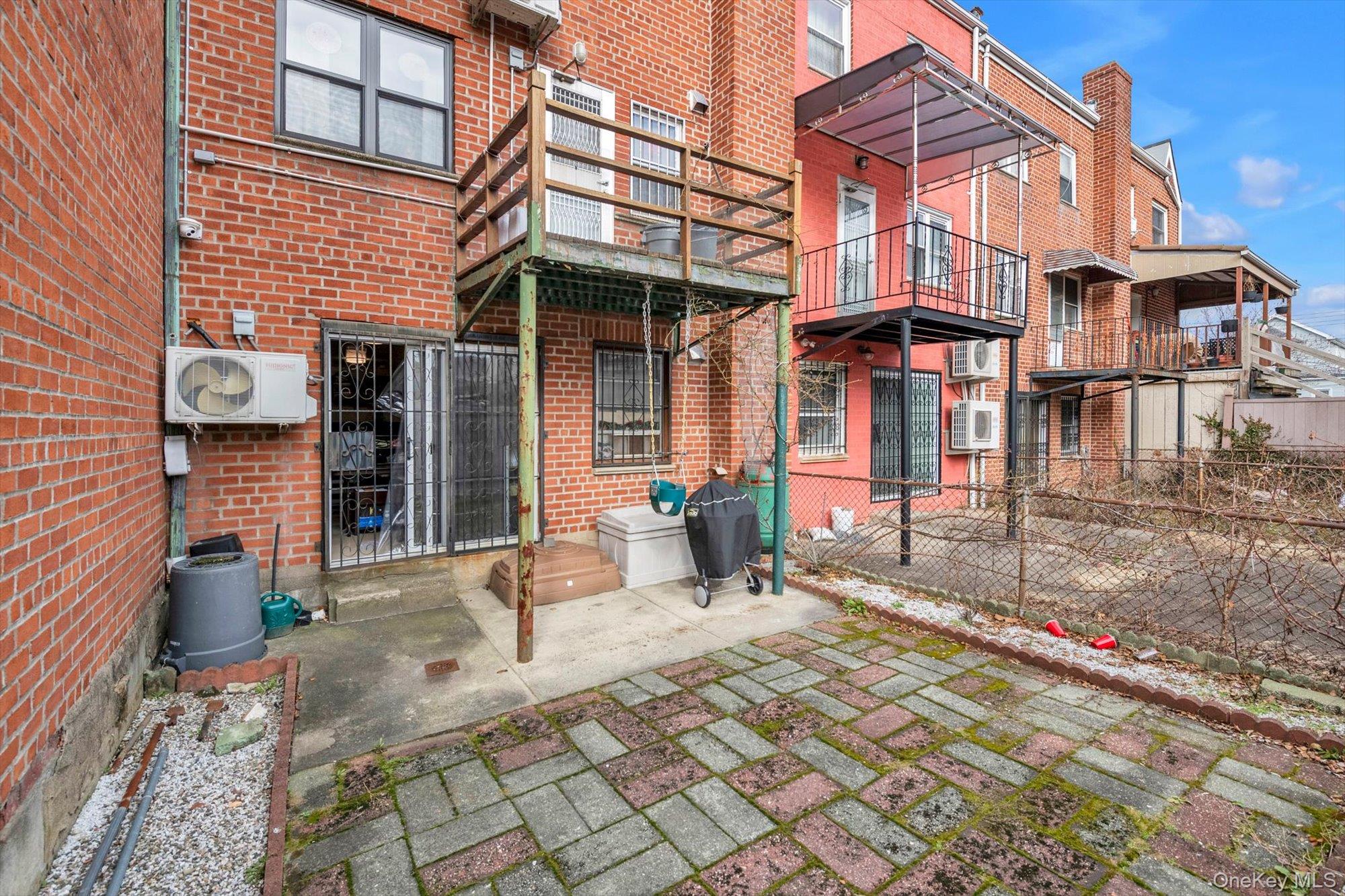 50-33 68th Street Queens, NY 11377 - Photo 15 of 17 a view of a brick house with many windows