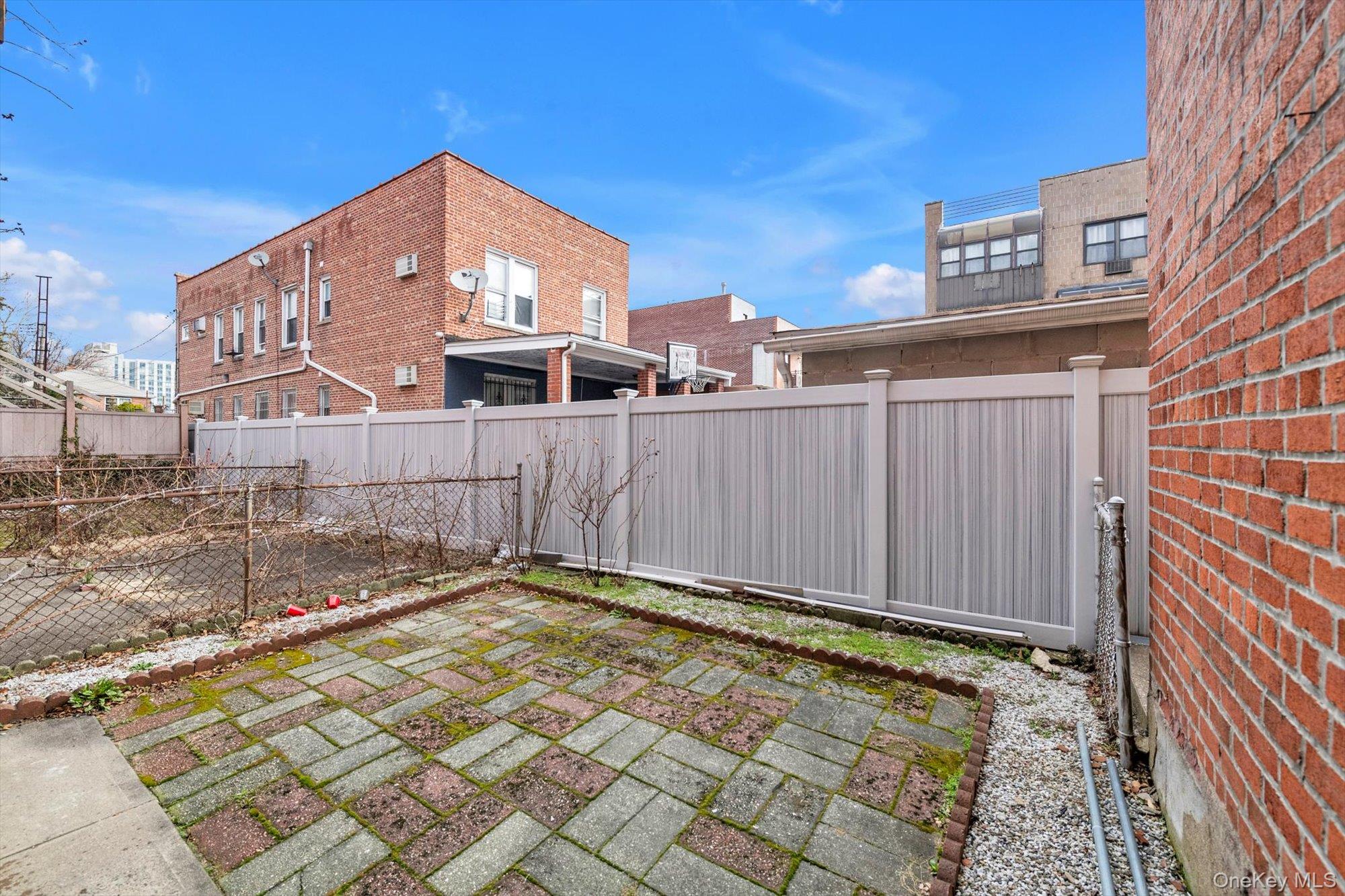 50-33 68th Street Queens, NY 11377 - Photo 16 of 17 a view of a house with a backyard