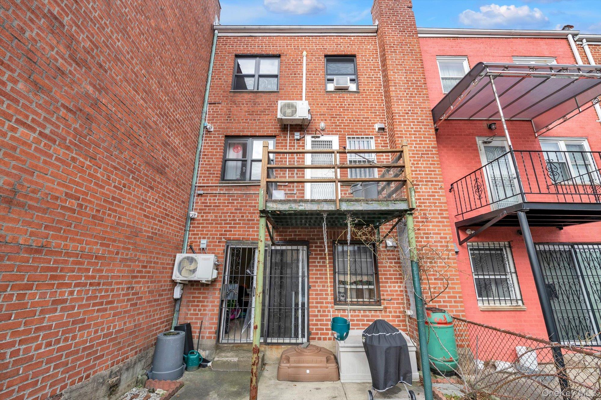 50-33 68th Street Queens, NY 11377 - Photo 17 of 17 a front view of a house with glass windows