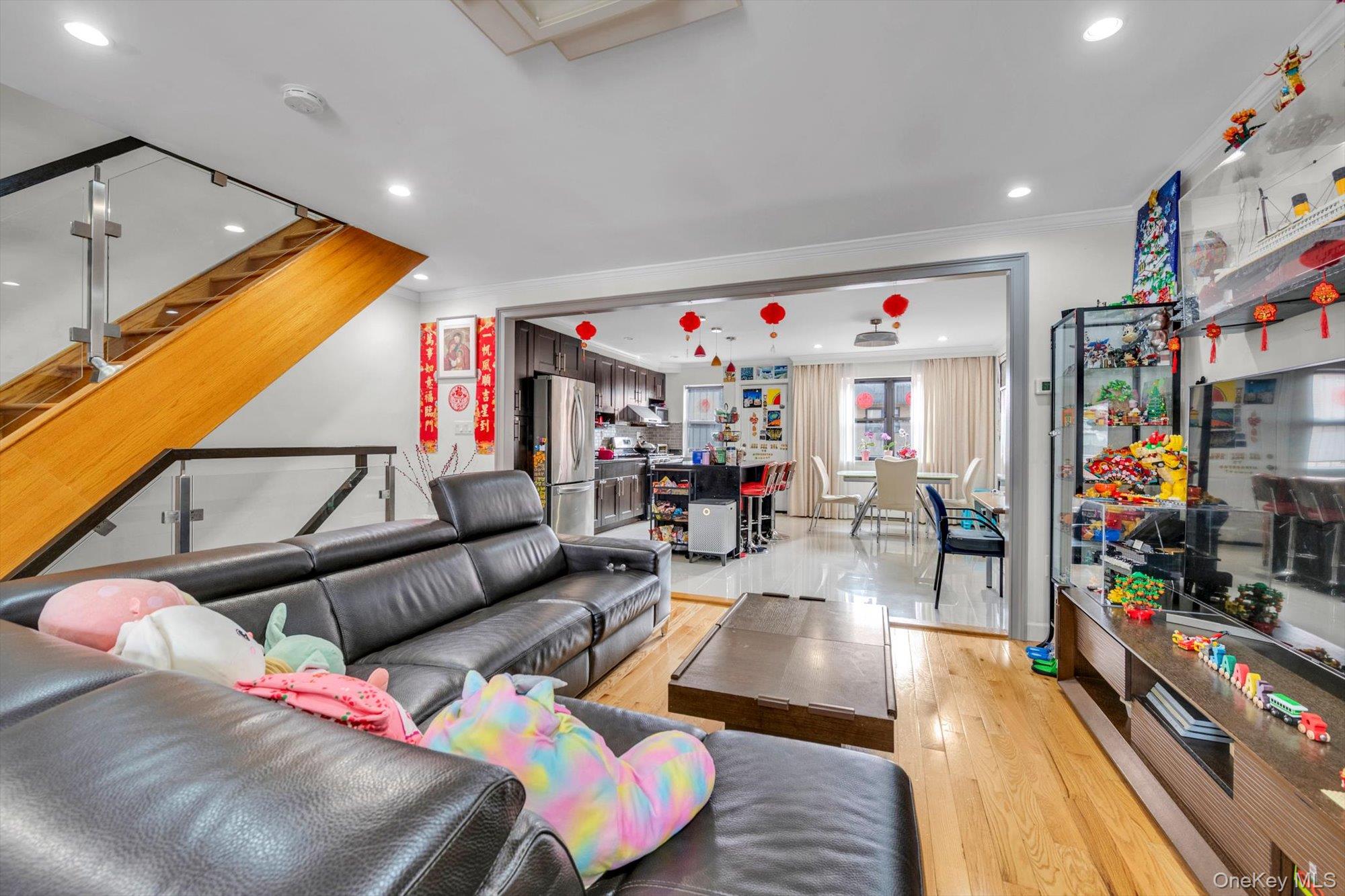 50-33 68th Street Queens, NY 11377 - Photo 5 of 17 a living room with fireplace furniture and a flat screen tv