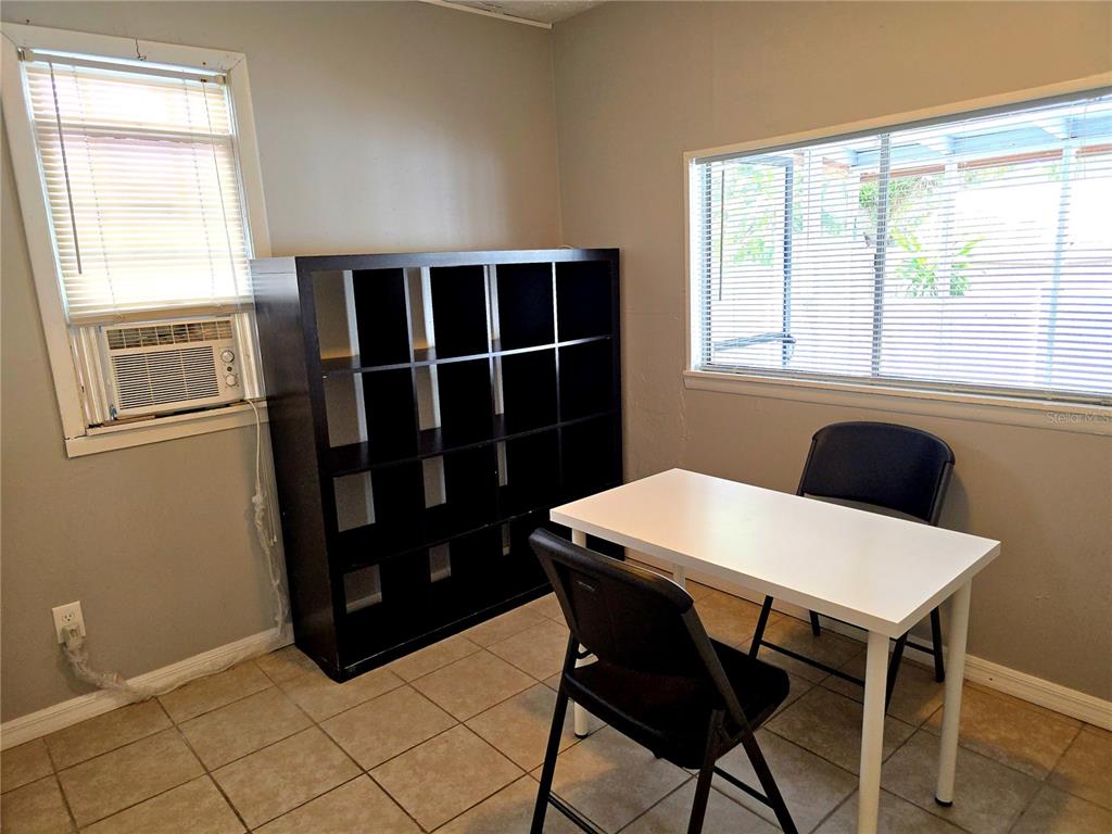 1839 Salem Road, Unit B Lakeland, FL 33803 - Photo 12 of 24 a view of a dining room that has a table and a chair with wooden floor