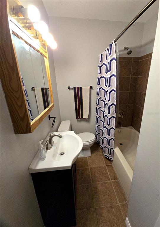1839 Salem Road, Unit B Lakeland, FL 33803 - Photo 15 of 24 a bathroom with a sink and mirror with toilet