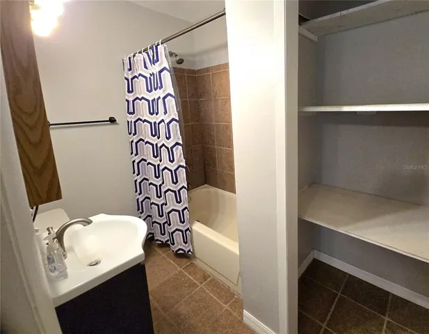 a bathroom with a bathtub and shower