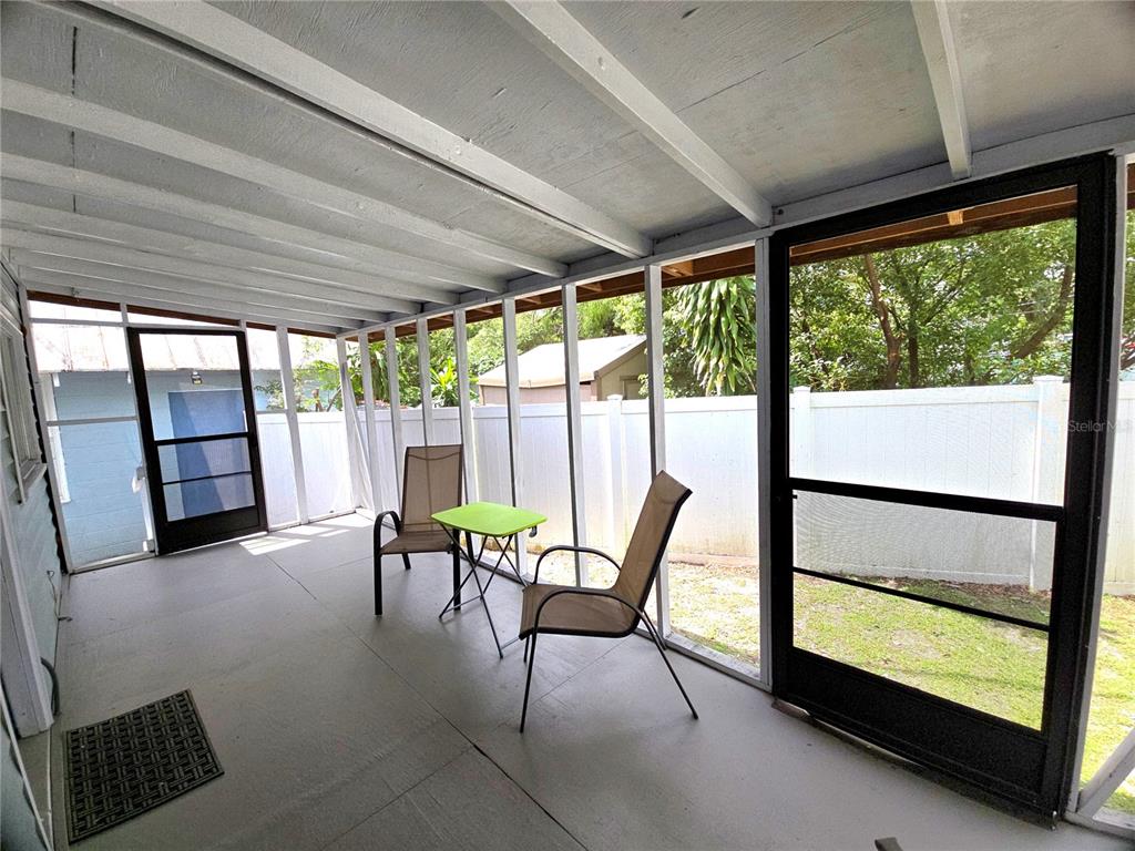 1839 Salem Road, Unit B Lakeland, FL 33803 - Photo 18 of 24 a view of a room with furniture and floor to ceiling windows