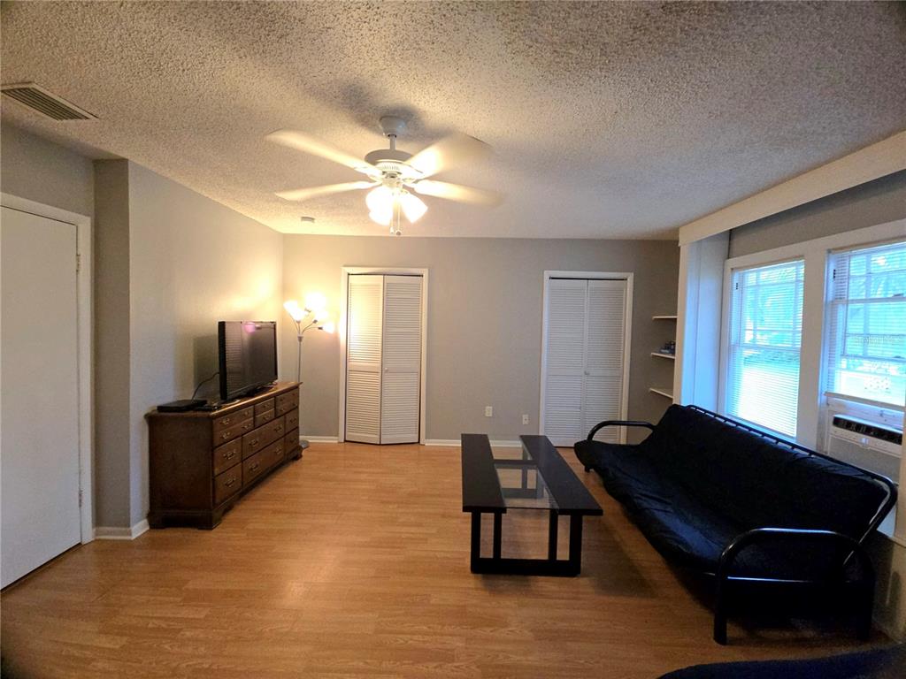 1839 Salem Road, Unit B Lakeland, FL 33803 - Photo 9 of 24 a living room with furniture and a flat screen tv