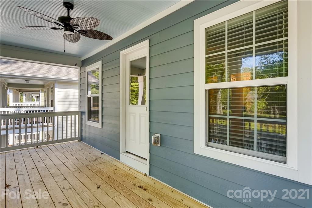 12208 Huntersville-Concord Road Huntersville, NC 28078 - Photo 20 of 33 a view of a balcony with a ceiling fan and wooden floor
