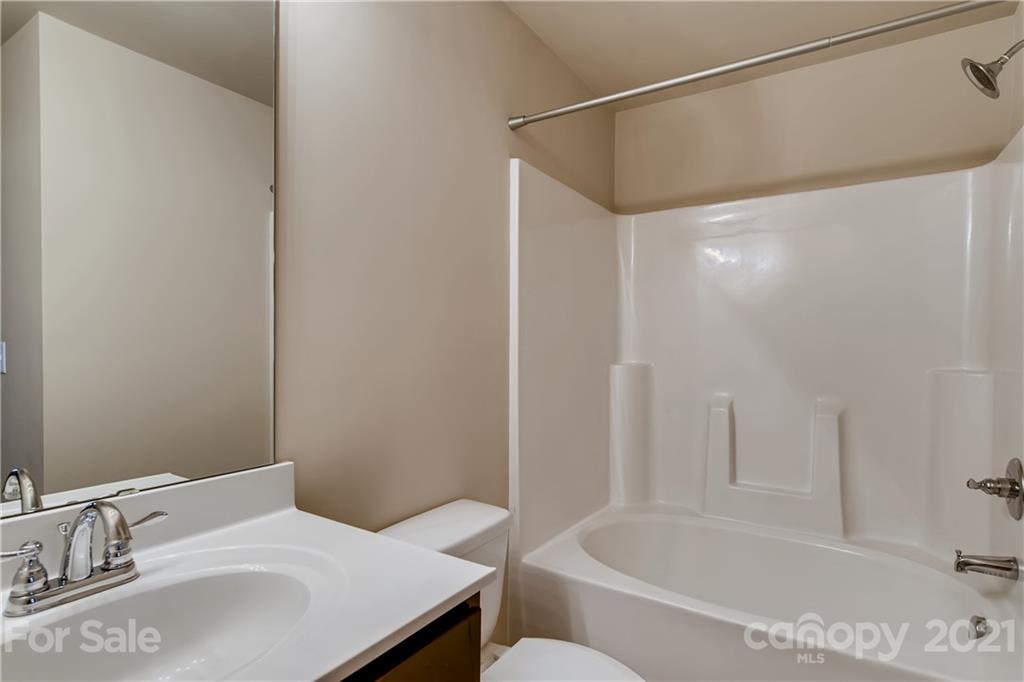 12208 Huntersville-Concord Road Huntersville, NC 28078 - Photo 24 of 33 a bathroom with a sink and a bathtub
