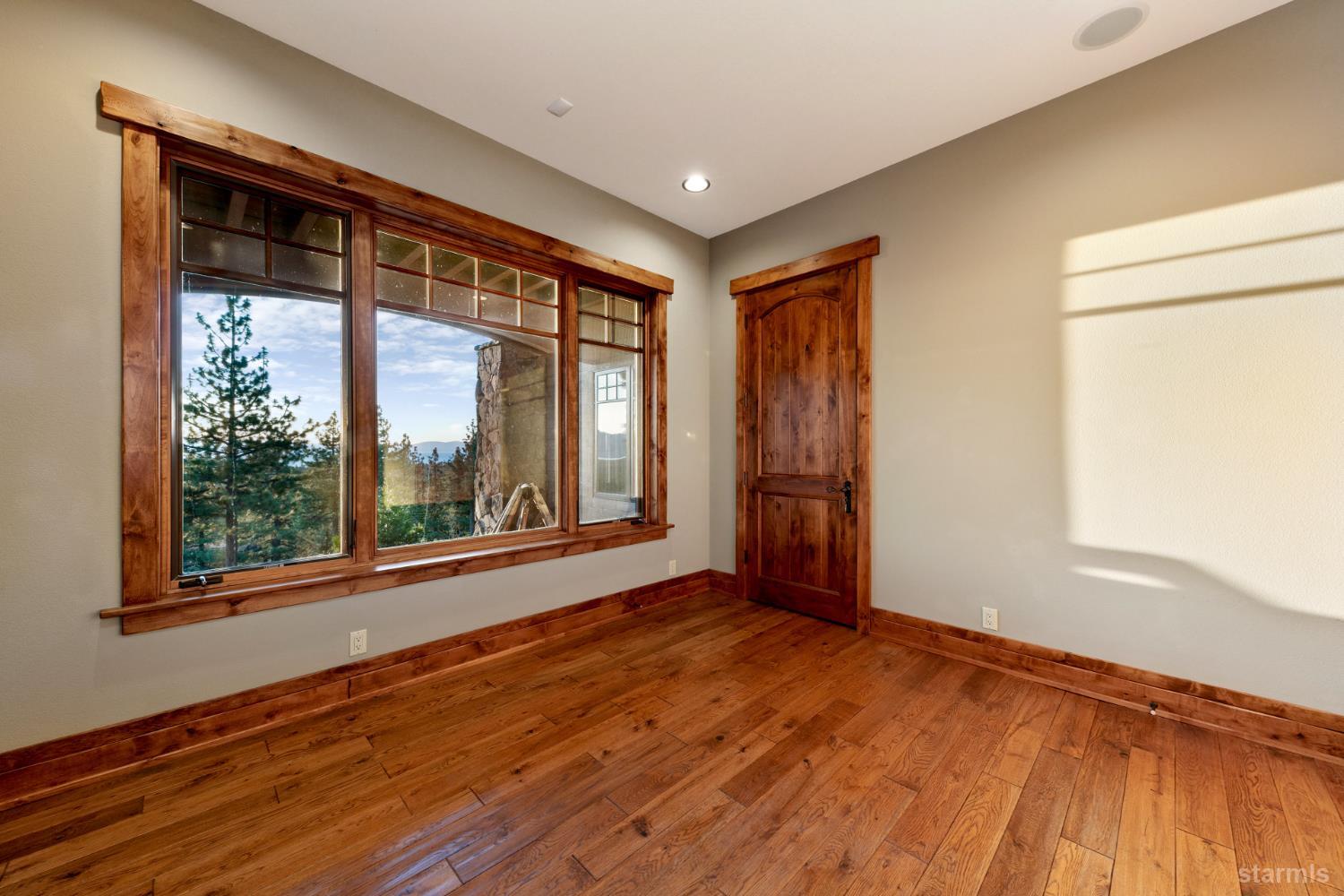 3567 Saddle Road South Lake Tahoe, CA 96150 - Photo 35 of 39 a view of an empty room with a window and wooden floor