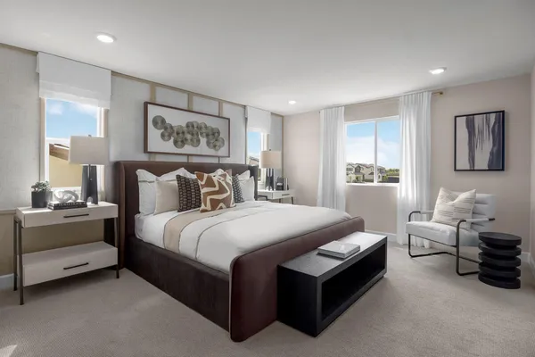 a bedroom with bed and window