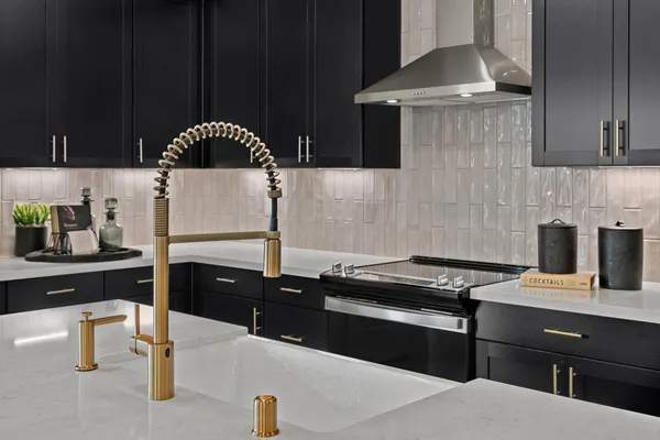 a kitchen with a sink and a stove