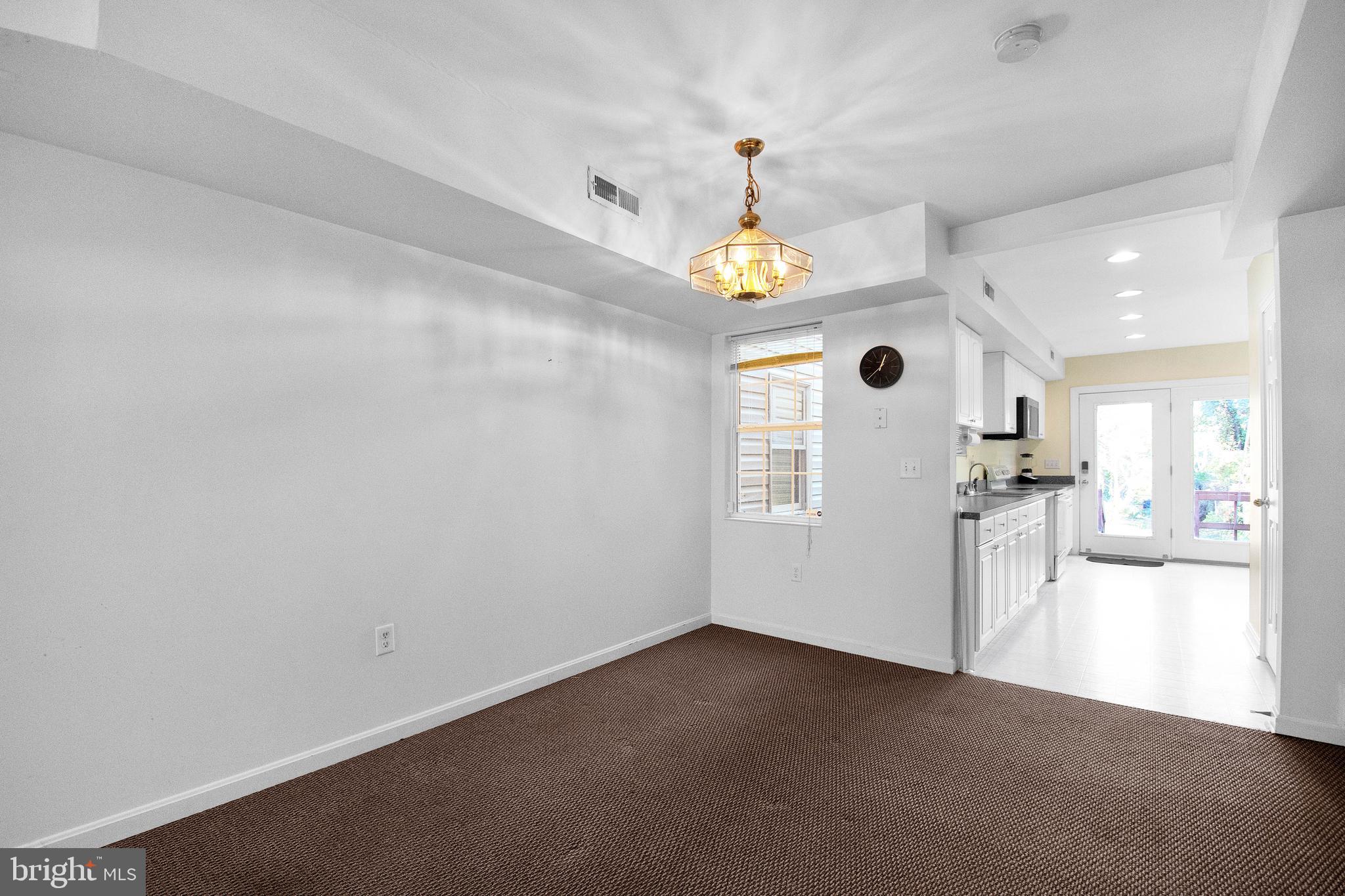 192 Clay Street Annapolis, MD 21401 - Photo 3 of 23 an empty room with kitchen and a window