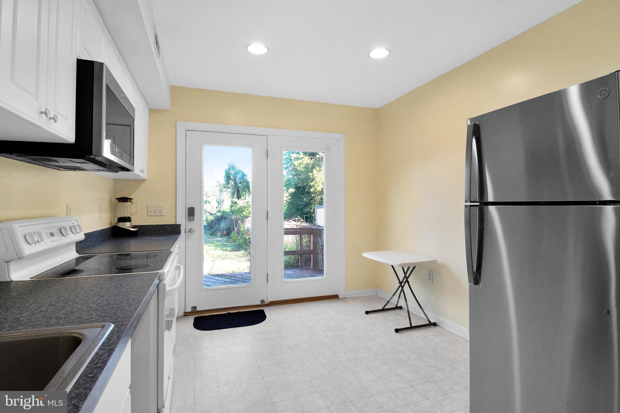 192 Clay Street Annapolis, MD 21401 - Photo 5 of 23 a kitchen with stainless steel appliances granite countertop a refrigerator a stove a sink and a microwave