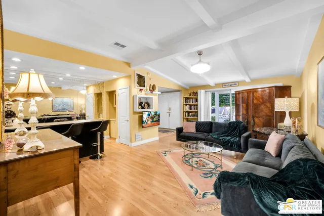 a living room with furniture and a table