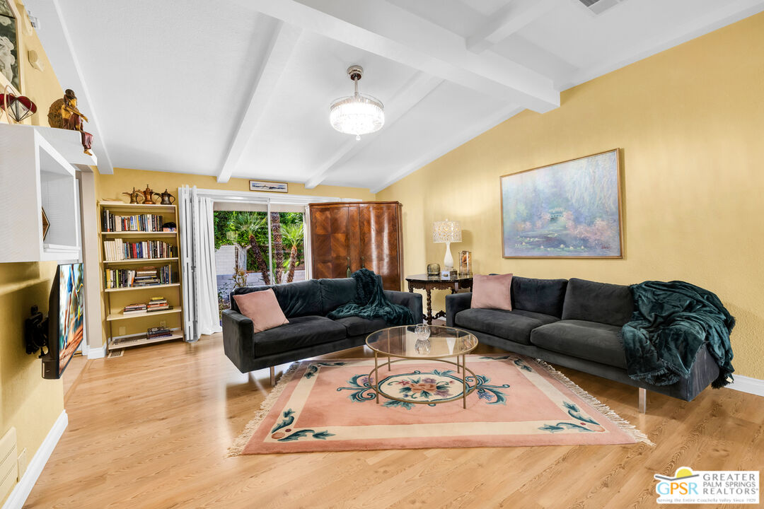 10 International Boulevard Rancho Mirage, CA 92270 - Photo 13 of 36 a living room with furniture a rug and a flat screen tv