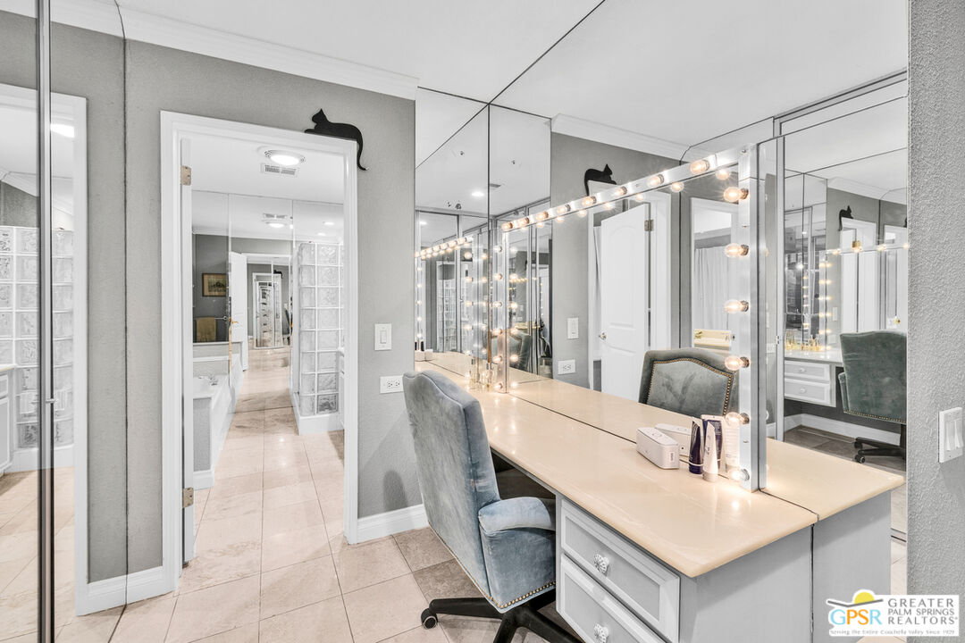 10 International Boulevard Rancho Mirage, CA 92270 - Photo 20 of 36 a dining room with furniture a chandelier and window