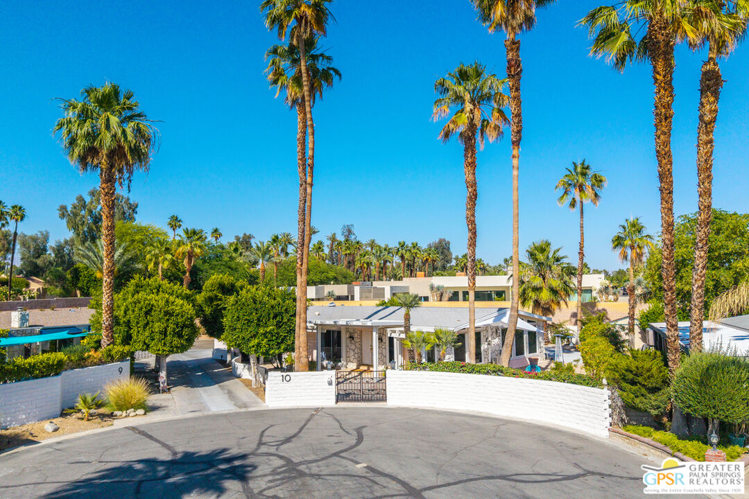 10 International Boulevard Rancho Mirage, CA 92270 - Photo 2 of 36 a view of a swimming pool with an outdoor seating