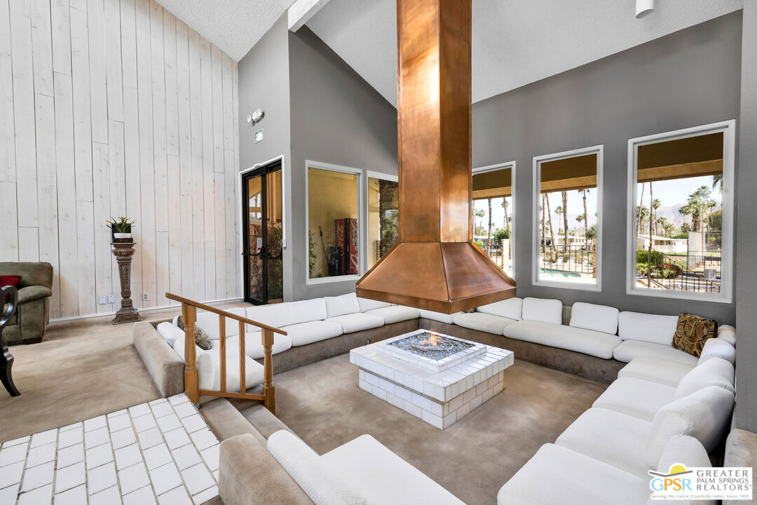 10 International Boulevard Rancho Mirage, CA 92270 - Photo 30 of 36 a living room with furniture and large window