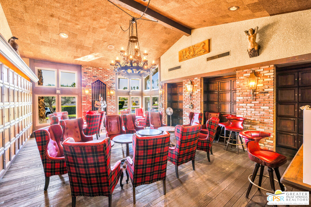 10 International Boulevard Rancho Mirage, CA 92270 - Photo 31 of 36 a group of people sitting outside of a building