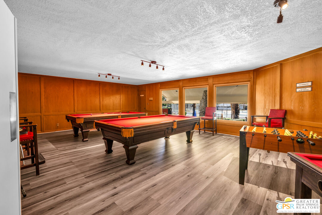 10 International Boulevard Rancho Mirage, CA 92270 - Photo 32 of 36 a room with furniture and a table