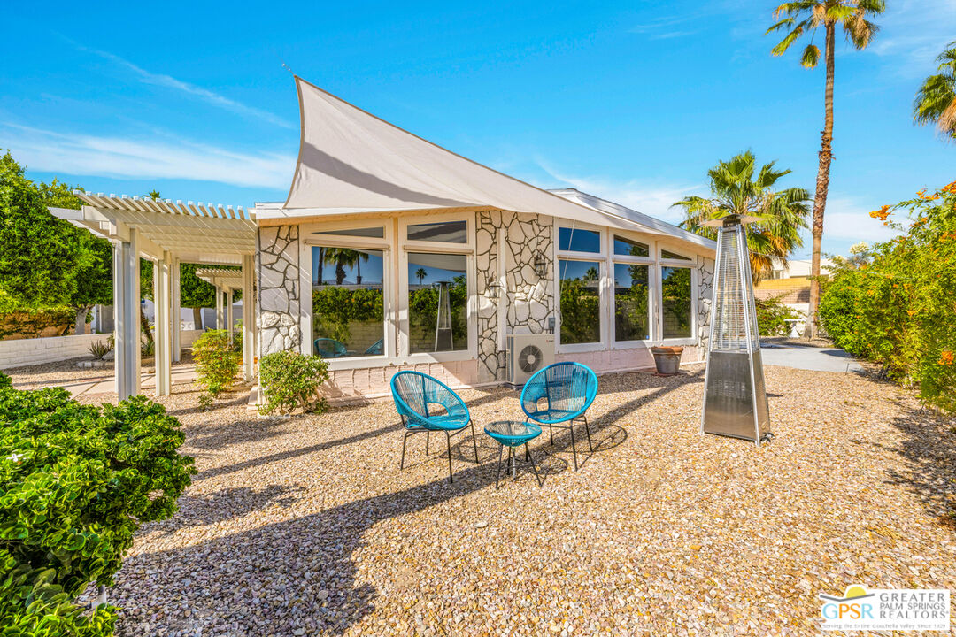 10 International Boulevard Rancho Mirage, CA 92270 - Photo 5 of 36 a house view with a sitting space and garden space