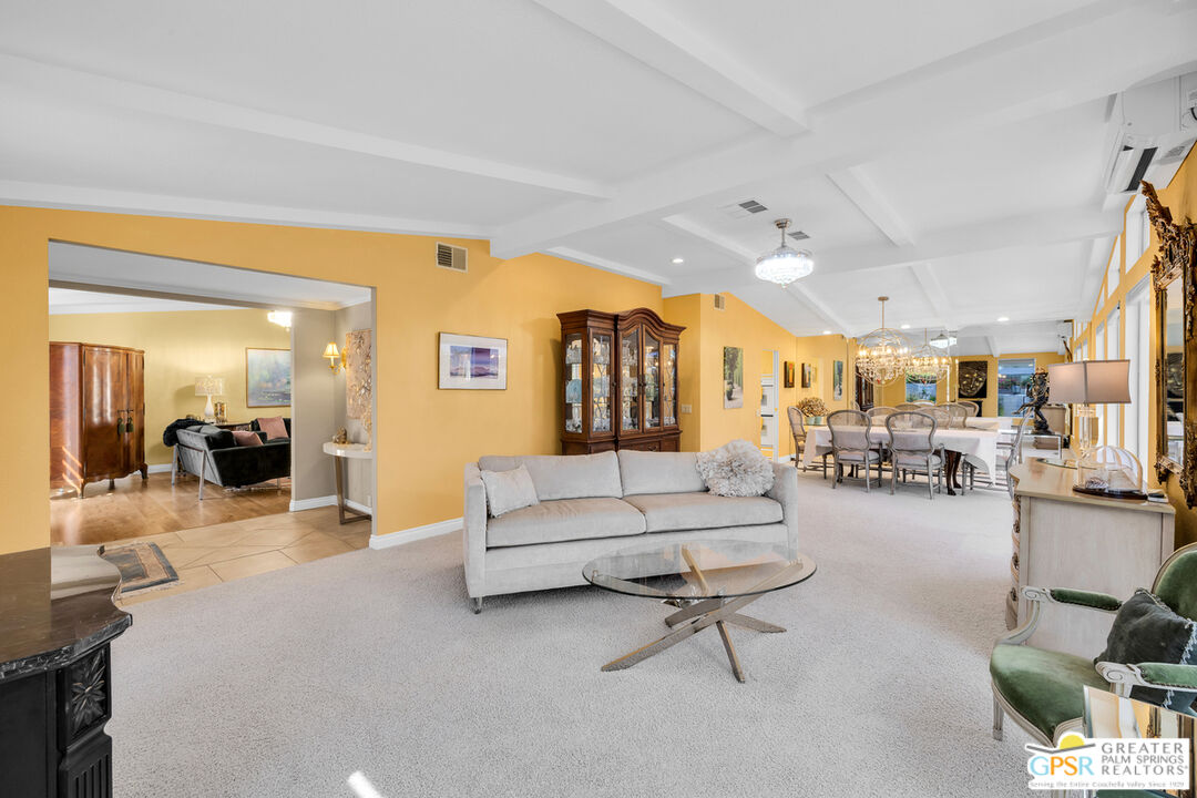 10 International Boulevard Rancho Mirage, CA 92270 - Photo 8 of 36 a living room with furniture and a large mirror