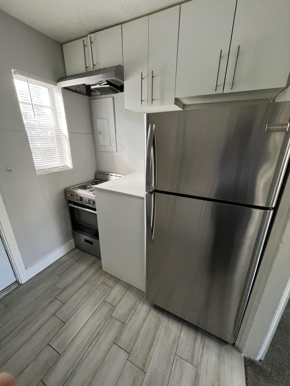 2722 Poinsettia Avenue, Unit 4 West Palm Beach, FL 33407 - Photo 3 of 6 a utility room with closet dryer and washer