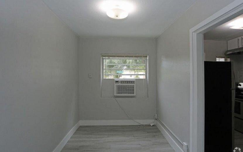 2722 Poinsettia Avenue, Unit 4 West Palm Beach, FL 33407 - Photo 6 of 6 a view of a room that has a window in it