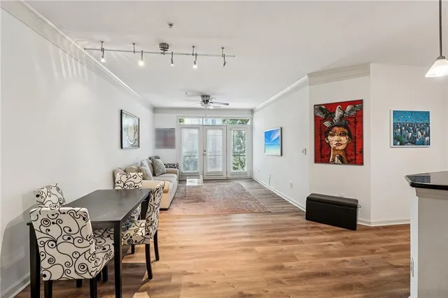 a kitchen with stainless steel appliances granite countertop a refrigerator a sink and a stove