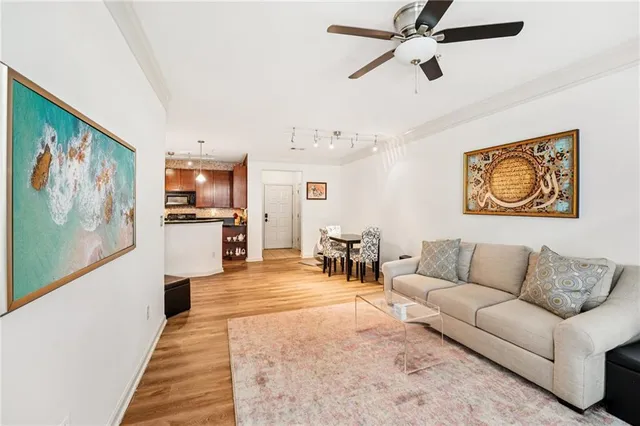 a kitchen with kitchen island granite countertop a sink stainless steel appliances and cabinets