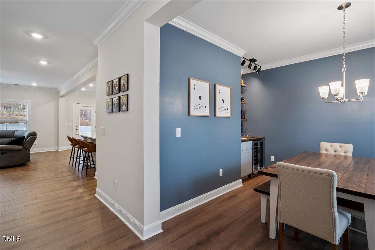 4038 Front Runner Drive Durham, NC 27703 - Photo 12 of 47 a view of a room with furniture and wooden floor