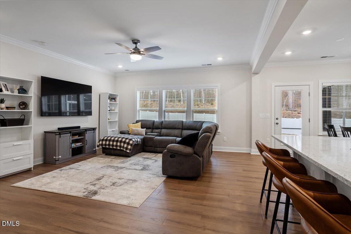 4038 Front Runner Drive Durham, NC 27703 - Photo 14 of 47 a living room with furniture and a flat screen tv